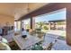Covered patio featuring outdoor dining, seating, and backyard views for relaxing and entertaining at 8024 W Vista Ave, Glendale, AZ 85303
