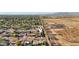 Expansive aerial view of the community showcasing the diverse landscape, homes, and distant mountain range at 8730 E Montecito Ave, Scottsdale, AZ 85251