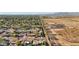 Expansive aerial view of the community showcasing the diverse landscape, homes, and distant mountain range at 8730 E Montecito Ave, Scottsdale, AZ 85251