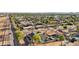Scenic aerial view features a home with a pool, lush landscaping, and proximity to neighborhood amenities at 8730 E Montecito Ave, Scottsdale, AZ 85251
