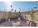 Inviting backyard fire pit area with built-in seating and decorative cinder block wall, great for entertaining at 8730 E Montecito Ave, Scottsdale, AZ 85251