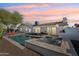 Inviting backyard with a refreshing pool, spa, and a cozy patio area perfect for outdoor gatherings at 8730 E Montecito Ave, Scottsdale, AZ 85251