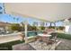 An outdoor patio with a pool and hot tub, great for entertaining guests and enjoying the weather at 8730 E Montecito Ave, Scottsdale, AZ 85251
