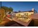 Wonderful backyard featuring a sparkling pool, spa, covered patio, and mature landscaping at 8730 E Montecito Ave, Scottsdale, AZ 85251