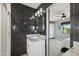 Bathroom featuring walk-in shower, granite countertops, and dark accents at 8730 E Montecito Ave, Scottsdale, AZ 85251