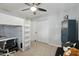 Cozy bedroom design featuring a bunk bed with desk, spacious closet, gray carpet, and a sturdy blue shelving unit at 8730 E Montecito Ave, Scottsdale, AZ 85251