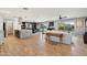 Open-concept living area with a kitchen island, dining space, and comfortable seating, perfect for entertaining at 8730 E Montecito Ave, Scottsdale, AZ 85251