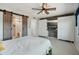 Spacious main bedroom with barn door to bathroom and built in cabinets at 8730 E Montecito Ave, Scottsdale, AZ 85251
