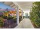 Charming walkway featuring a covered entrance, tiled path, and lush garden at 8730 E Montecito Ave, Scottsdale, AZ 85251