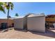 Backyard featuring two storage sheds with a view of the property at 930 E Friar Ave, Apache Junction, AZ 85119