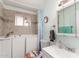 Bathroom with neutral tile and a jacuzzi style bathtub at 930 E Friar Ave, Apache Junction, AZ 85119