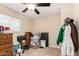 Bedroom with ceiling fan, neutral walls, and closet at 930 E Friar Ave, Apache Junction, AZ 85119