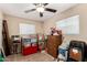 Bedroom with ceiling fan, blinds and large dresser at 930 E Friar Ave, Apache Junction, AZ 85119