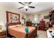 Bedroom with carpet, ceiling fan, and window at 930 E Friar Ave, Apache Junction, AZ 85119