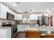 Beautiful kitchen featuring white cabinetry, stainless steel appliances, and granite countertops at 930 E Friar Ave, Apache Junction, AZ 85119