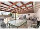 Covered patio with metal roof, a table and seating at 930 E Friar Ave, Apache Junction, AZ 85119