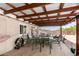 Covered patio with metal roof, a table and seating at 930 E Friar Ave, Apache Junction, AZ 85119