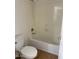 Bathroom features a white tub with a shower head and white toilet at 9556 W Blue Sky Dr, Peoria, AZ 85383