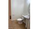 Powder room features a pedestal sink, toilet, and tiled floors at 9556 W Blue Sky Dr, Peoria, AZ 85383