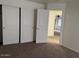 Bedroom with neutral carpeting, and a sliding-door closet at 9556 W Blue Sky Dr, Peoria, AZ 85383