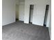 This bedroom features a closet with mirrored sliding doors and neutral carpeting at 9556 W Blue Sky Dr, Peoria, AZ 85383