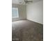 Bedroom with modern ceiling fan, plush carpeting and a large window at 9556 W Blue Sky Dr, Peoria, AZ 85383
