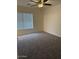 Neutral bedroom with carpet and a ceiling fan at 9556 W Blue Sky Dr, Peoria, AZ 85383