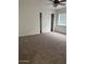 Bedroom with neutral carpeting, a ceiling fan, and a sliding-door closet at 9556 W Blue Sky Dr, Peoria, AZ 85383