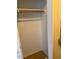 Walk-in closet with rod for hanging clothes and neutral interiors at 9556 W Blue Sky Dr, Peoria, AZ 85383