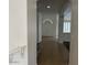 Inviting hallway features tile flooring leading to the front entrance at 9556 W Blue Sky Dr, Peoria, AZ 85383