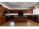 Spacious kitchen features an island, stainless steel appliances, and ample cabinet space at 9556 W Blue Sky Dr, Peoria, AZ 85383
