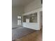 Open-concept living room featuring plush carpet, ample natural light, and neutral paint at 9556 W Blue Sky Dr, Peoria, AZ 85383