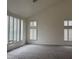Open living space features neutral walls, carpet and shuttered windows, maximizing natural light at 9556 W Blue Sky Dr, Peoria, AZ 85383