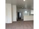 Upstairs living room with neutral carpet, and a view into adjacent rooms, offering an open space at 9556 W Blue Sky Dr, Peoria, AZ 85383