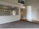 Spacious living room with neutral carpet and architectural details creating an inviting atmosphere at 9556 W Blue Sky Dr, Peoria, AZ 85383
