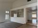 Bright living room with neutral carpeting and views into adjacent rooms, enhancing the open feel at 9556 W Blue Sky Dr, Peoria, AZ 85383