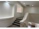 Carpeted staircase with white railing and upper level open to the first floor at 9556 W Blue Sky Dr, Peoria, AZ 85383