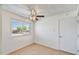 Bright room featuring a ceiling fan, a large window, and neutral paint at 9635 W Ironwood Dr # B, Peoria, AZ 85345