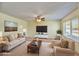 Inviting living room with large windows, neutral tones, and comfortable seating arrangement at 9635 W Ironwood Dr # B, Peoria, AZ 85345