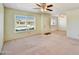 Bright living room with large window, neutral walls, and open floor plan at 9635 W Ironwood Dr # B, Peoria, AZ 85345