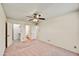 Spacious main bedroom with ceiling fan and ensuite bathroom access at 9635 W Ironwood Dr # B, Peoria, AZ 85345