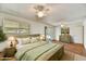 Stylishly furnished main bedroom with ceiling fan and backyard access at 9635 W Ironwood Dr # B, Peoria, AZ 85345