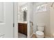 Bright bathroom featuring tile floors and safety grab bars at 10040 E Grandview St, Mesa, AZ 85207