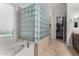 Bathroom showcases a bathtub, walk-in shower with glass blocks, and closet access at 10040 E Grandview St, Mesa, AZ 85207