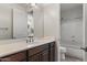 Bright bathroom featuring marble countertop vanity and chrome fixtures at 10040 E Grandview St, Mesa, AZ 85207