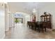 Open-concept dining room with elegant chandelier, tile floors, and plenty of natural light at 10040 E Grandview St, Mesa, AZ 85207