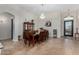 Elegant dining room featuring a chandelier, a wooden table with seating for six, and tile floors at 10040 E Grandview St, Mesa, AZ 85207