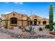 Charming single-story home with desert landscaping, decorative rock, and a private yard at 10040 E Grandview St, Mesa, AZ 85207