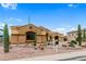 Single-story home boasting desert landscaping, mature cacti, and private driveway at 10040 E Grandview St, Mesa, AZ 85207