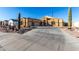 Charming single-Gathering home featuring a desert landscape, a spacious driveway, and an attached three-car garage at 10040 E Grandview St, Mesa, AZ 85207